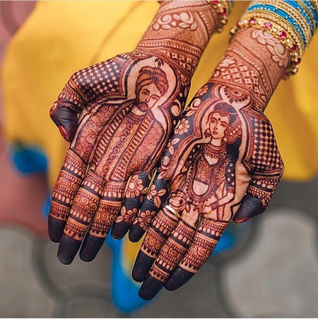 Intricate hand mehndi design with bride and groom portrait 