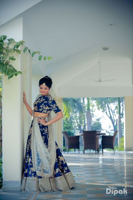 Navy blue lehenga with floral motifs for sangeet