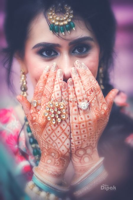 Photo of Bridal hands with manicure and rings