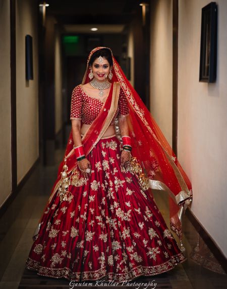 Photo of Red lehenga with silver floral zardozi work