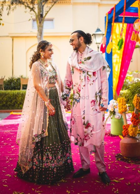 funky floral mehendi outfits for the bride and groom 