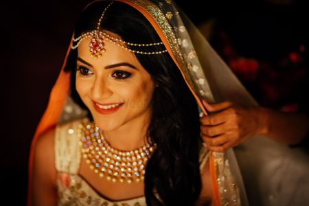 Bride in minimal jewellery and diamond necklace