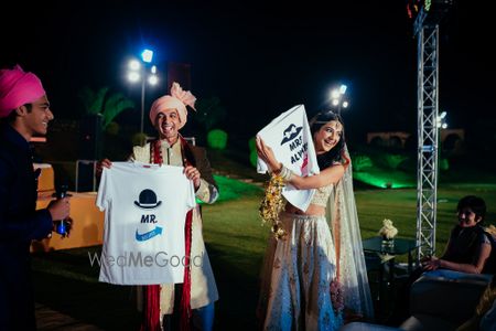 Couple holding customised tshirts