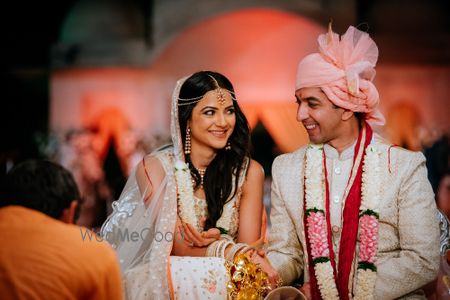 Matching bride and groom wearing white