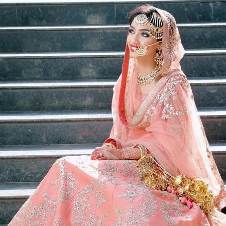 Pakistani bridal look with jewellery and dupatta draping style