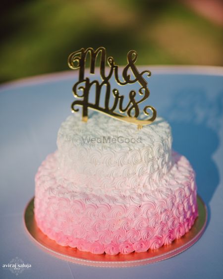Pink and white ombre cake with mr and mrs cake topper