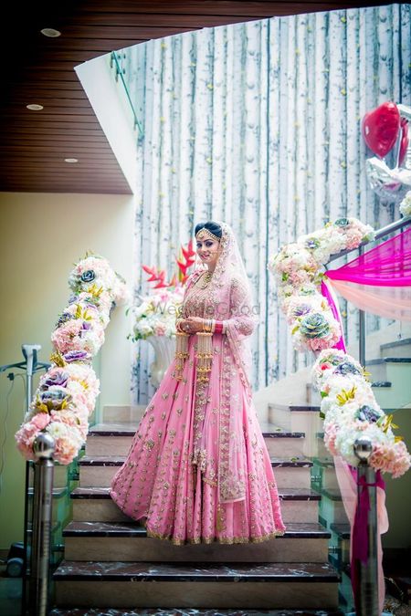 Morning bride in light pink and gold lehenga