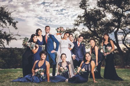 Couple with matching bridesmaids in blue