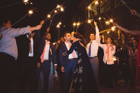 Couple entry idea with guests holding sparklers