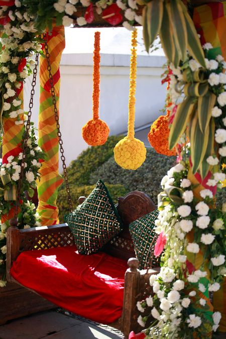 Floral swing with hanging floral balls for mehendi