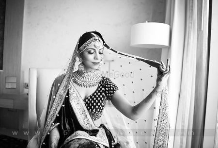 Bride holding dupatta bridal portrait idea in black and white