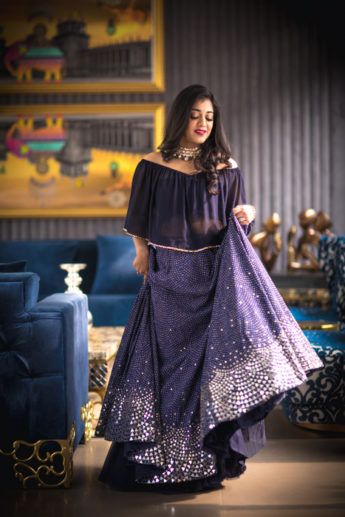 Photo of Purple lehengas with silver motifs and off shoulder blouse