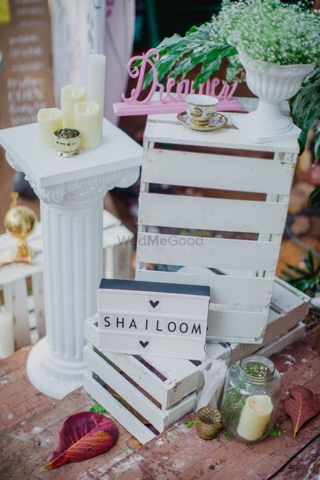 All white decor idea to display personalised wedding hashtag