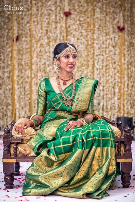 South Indian bride in green and gold kanjivaram
