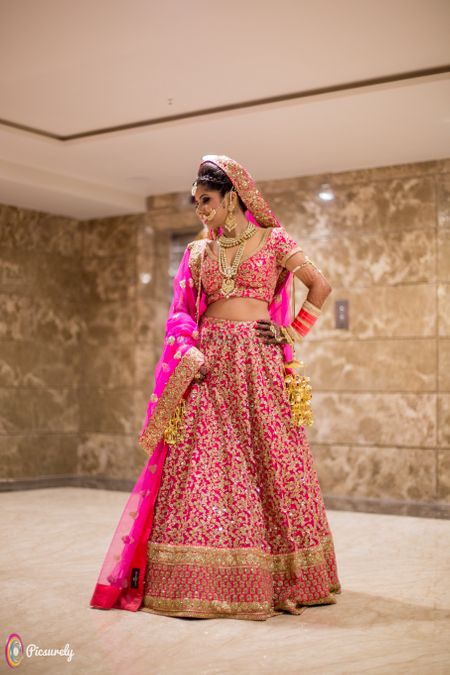 Hot pink bridal lehenga with gold sequin work