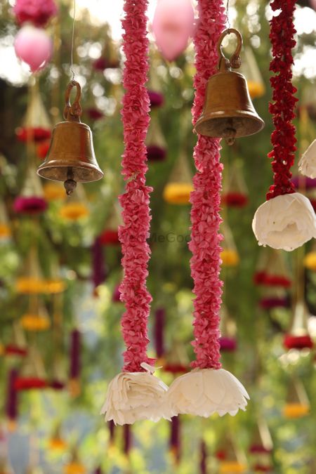 Photo of Hanging temple bells and floral strings South Indian wedding decor