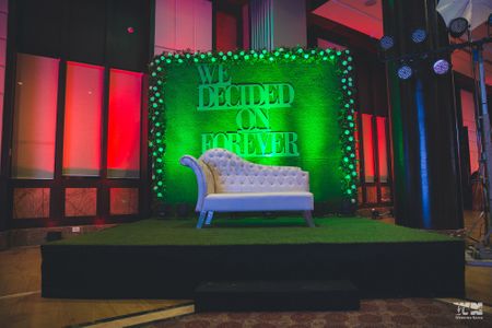 Photo of Modern stage decor with botanical wall and saying