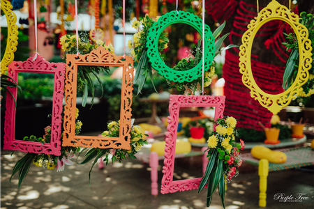 Using colourful suspended frames for a photobooth.