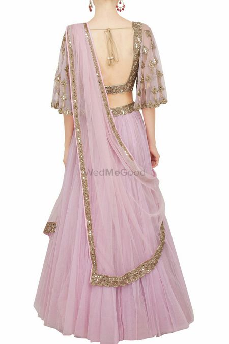 Onion pink lehenga with dull gold work and cape sleeves