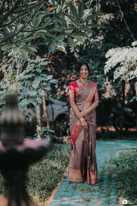 Photo of Candid shot of a South Indian bride.