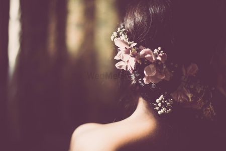 Photo of Fairytale braid from behind with flowers