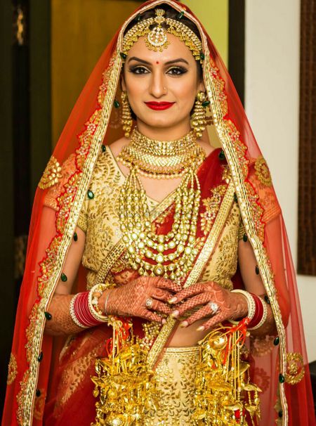 Akriti Kakkar in Crimson Bridal Lehenga