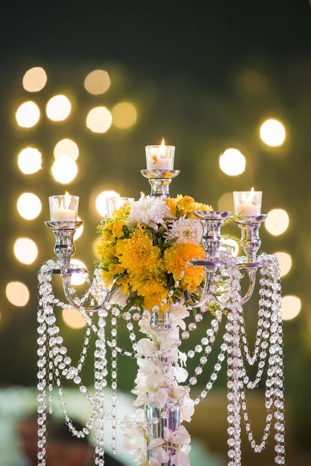 Centrepiece with candles and flowers