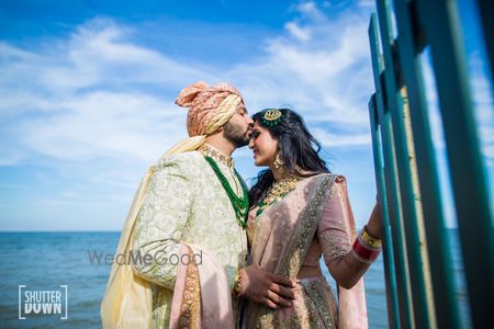 Romantic couple shot with groom kissing bride