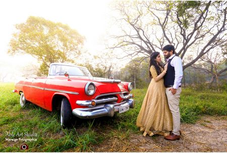 Photo of Pre wedding shoot with red vintage car