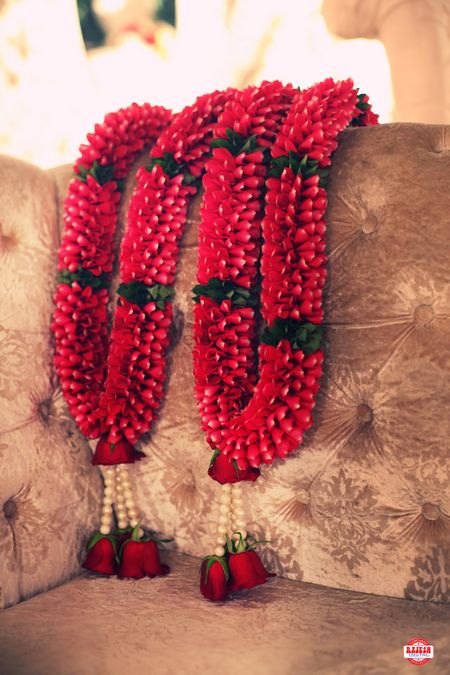 Red jaimala with hanging pearls and roses