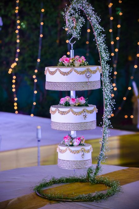 White three tier suspended wedding cake
