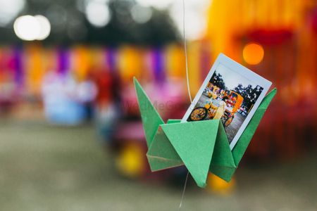 Ideas to display polaroids on hanging paper props