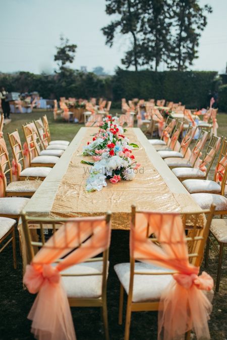 Backyard wedding decor with gold and peach theme