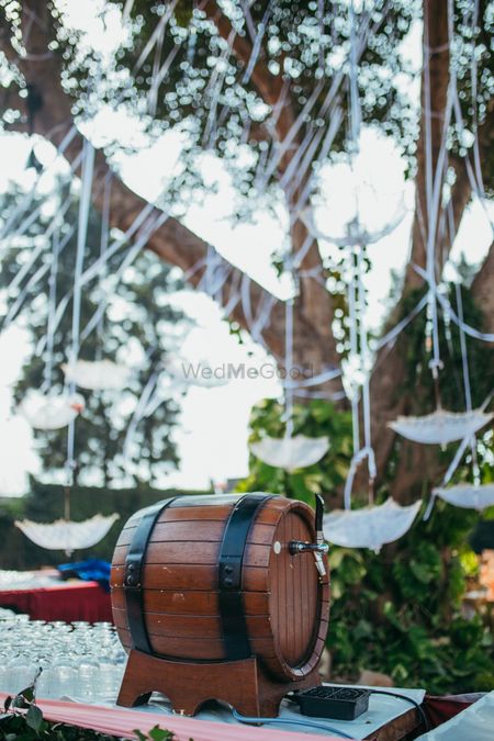 Food display idea with beer barrel for backyard wedding