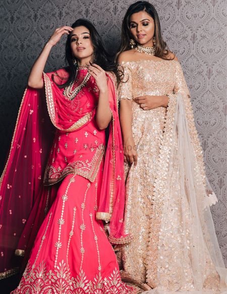 Off-shoulder gold engagement gown and pink sharara