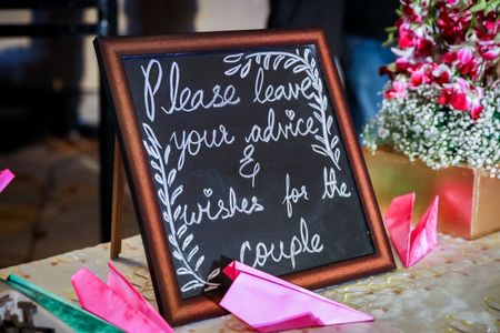 Chalkboard decor idea for guests to leave messages for the couple