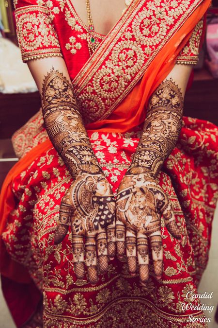 Bridal mehendi with half and half design with bride and groom portraits