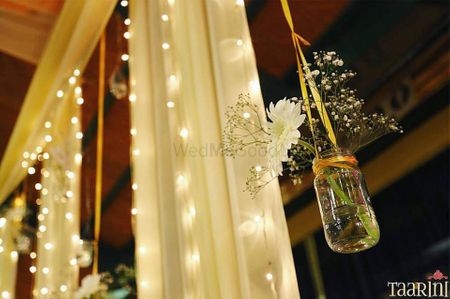 Hanging jars in decor with flowers