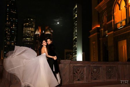 Photo of Flowing silver backless reception gown