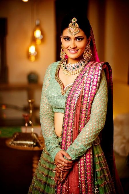 Mint green bridal lehenga with red dupatta for offbeat bride