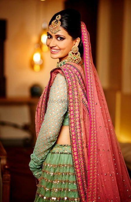 Photo of Unique green and bridal lehenga with red dupatta