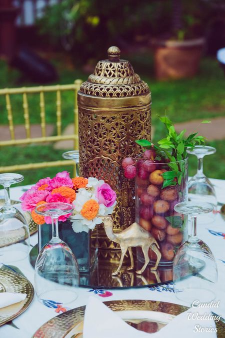 Table centrepiece idea with mirror and fruits