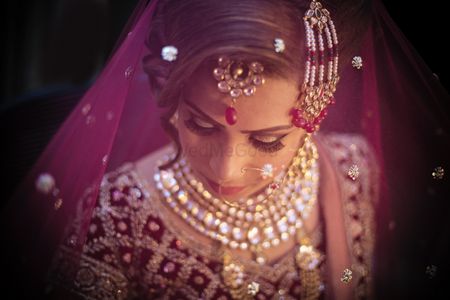 Photo of Stunning bride under veil shot