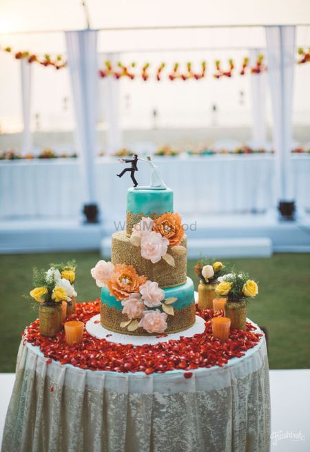 3 tier wedding cake in teal and gold 
