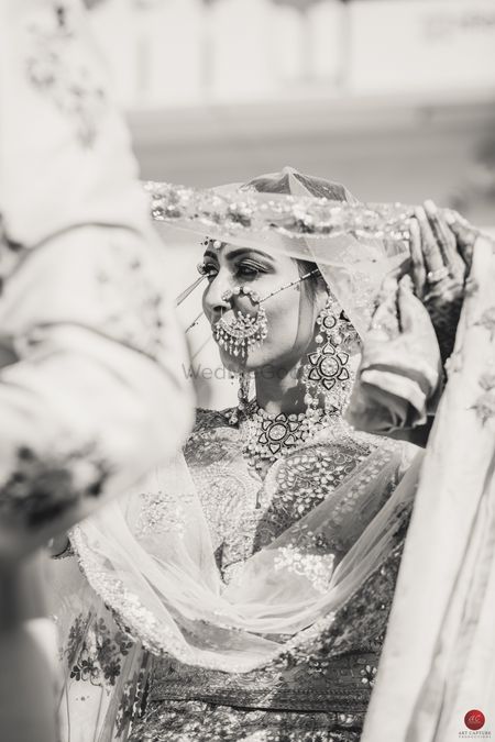 Black and white bridal portrait of bride wearing vintage Nath