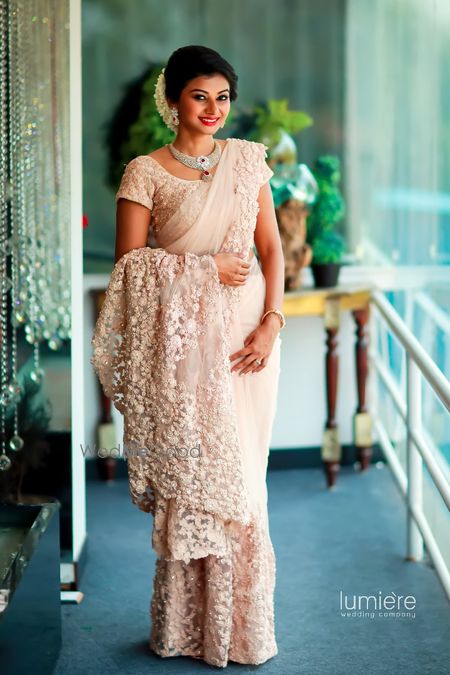 White lace saree with train for south indian bride