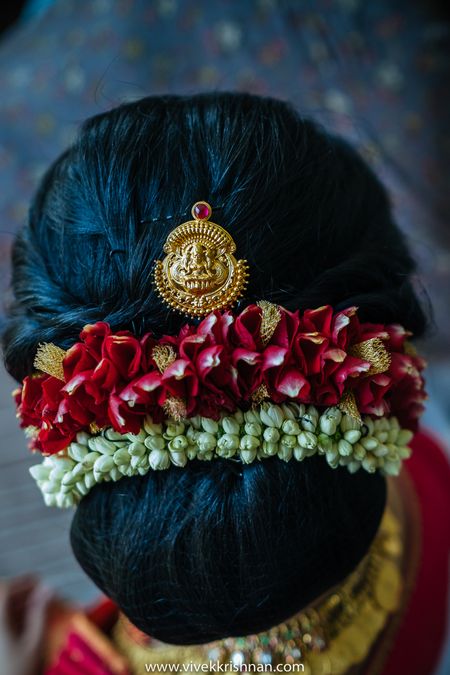 South Indian bridal hairstyle with flowers and jewellery 