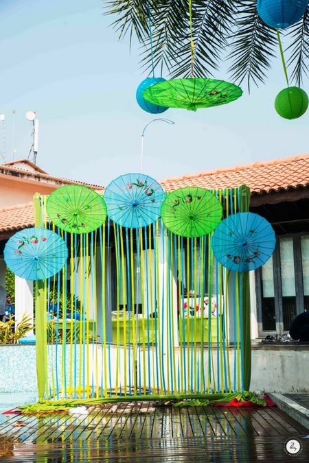 Photo of DIY Photo Booth idea with paper umbrellas