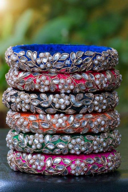 Photo of Fabric bangles with zardozdi and pearl work as mehendi favours
