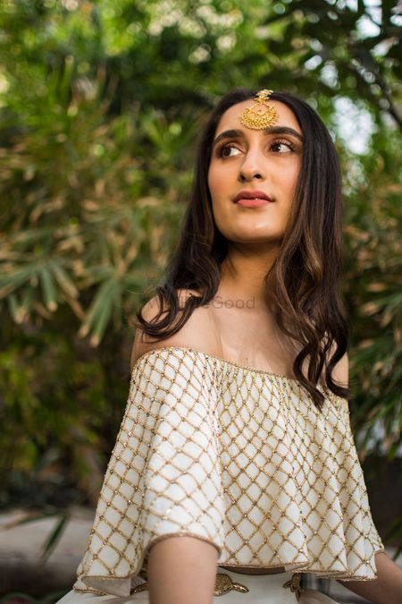 Photo of Gold and white cape style top